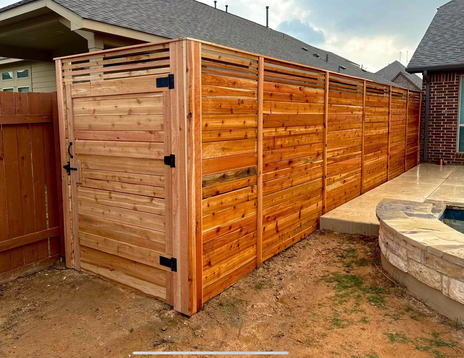 The Best Privacy Fence for Austin Backyards (Cedar vs. Pressure-Treated)